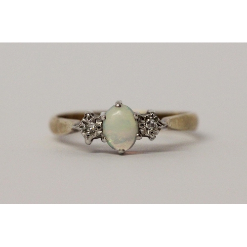 547 - An opal and diamond three stone ring on hallmarked 9ct gold band, ring size P, 2gms