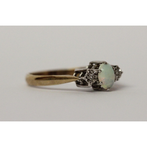 547 - An opal and diamond three stone ring on hallmarked 9ct gold band, ring size P, 2gms