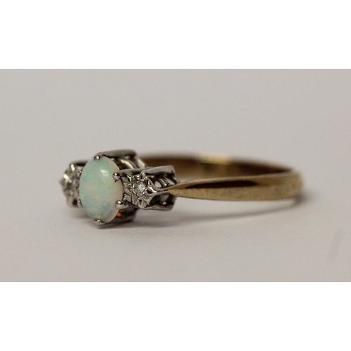 547 - An opal and diamond three stone ring on hallmarked 9ct gold band, ring size P, 2gms