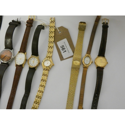 561 - A collection of eight ladies wristwatches to include a Swatch, Tissot, Lorus etc