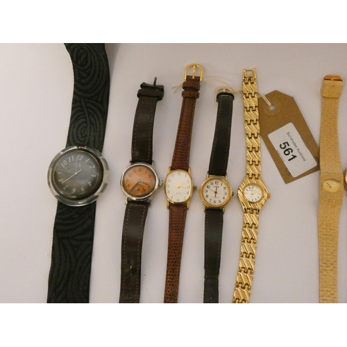 561 - A collection of eight ladies wristwatches to include a Swatch, Tissot, Lorus etc