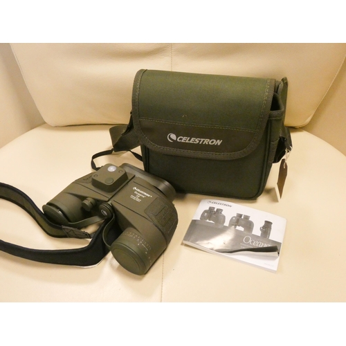 566 - A pair of Celestron Oceana binoculars and monocular with case and manual