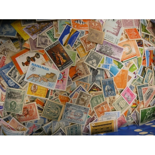 569 - A large collection of mint and mint hinged stamps and other stamps etc