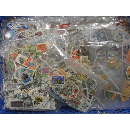 570 - A large collection of English and foreign stamps all in assorted packs to include Australia, Malaysi... 