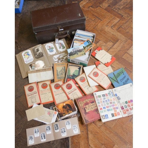 572 - A selection of assorted postcards, various London and other maps, three stamp albums etc, all contai... 