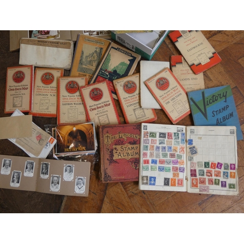 572 - A selection of assorted postcards, various London and other maps, three stamp albums etc, all contai... 