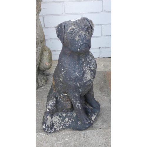 659 - A reconstituted painted concrete garden ornament of a dog, approximately 22