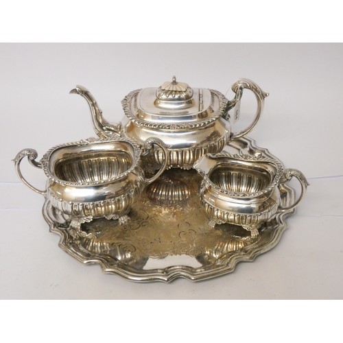 584 - A Walker & Hall silver plated three piece tea set, together with tray, pair of candlesticks and a wa... 