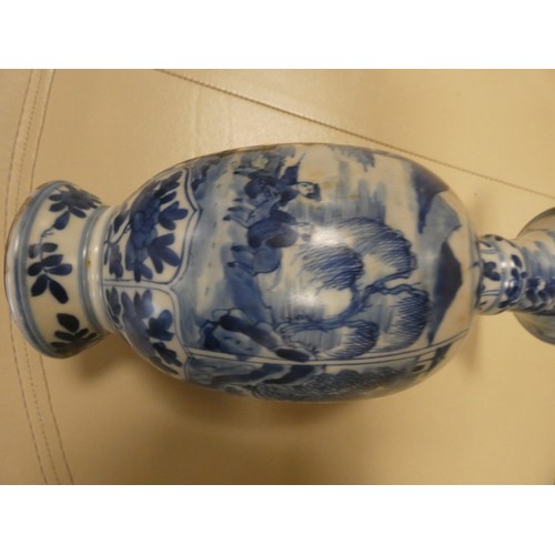 166 - A Chinese blue and white vase decorated with a landscape scene, Art leaf to base. 28cms tall