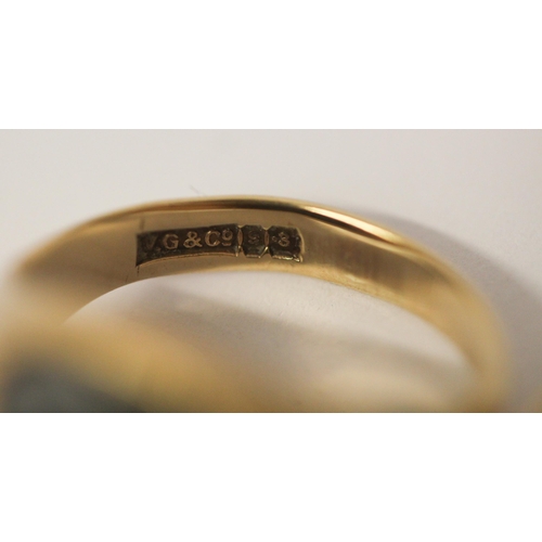 523 - A 9ct gold signet ring set with a diamond, size Q and another 9ct yellow gold onyx panel signet ring... 