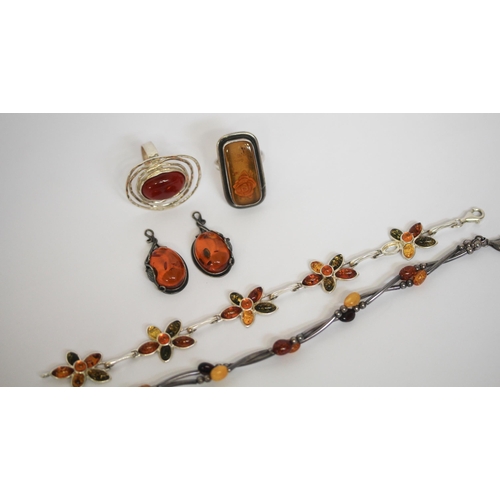 554 - A selection of silver and Baltic amber jewellery