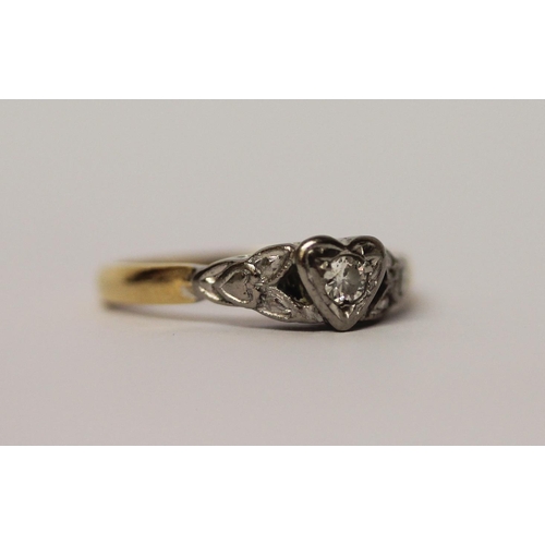 561 - Vintage diamond ring set in a heart shaped setting, on 18ct gold and platinum setting, ring size K, ... 