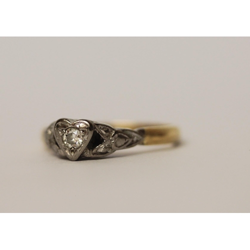 561 - Vintage diamond ring set in a heart shaped setting, on 18ct gold and platinum setting, ring size K, ... 