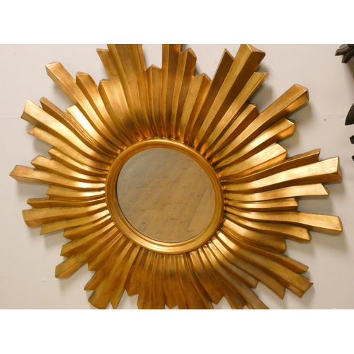 353 - A circular bevelled gilt sunburst wall mirror, 3'6 across approximately