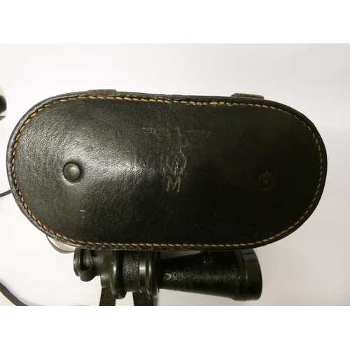 219 - A pair of Kriegsmarine binoculars in original black leather carrying case with eagle and swastika mo... 