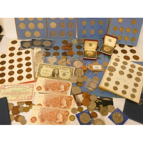 224 - A collection of British coins to include commemorative crowns, various coin collector folders contai... 