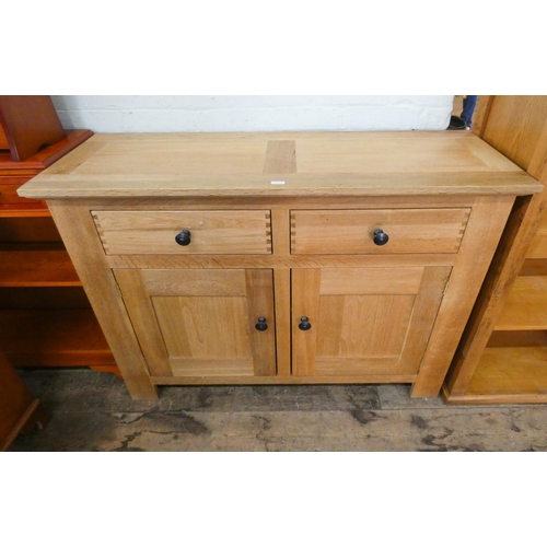 166 - A good quality modern light oak sideboard fitted two drawers and cupboards, 4' wide