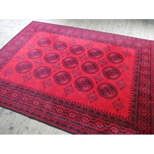 59 - Good quality red and Bokhara patterned Wilton carpet, 12' x 9'