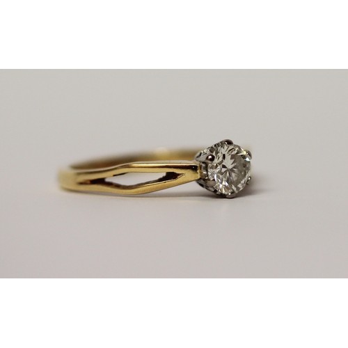 565 - A diamond engagement ring, claw set circular brilliant cut diamond of 54 points, on 18ct yellow gold... 