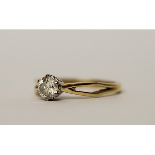 565 - A diamond engagement ring, claw set circular brilliant cut diamond of 54 points, on 18ct yellow gold... 