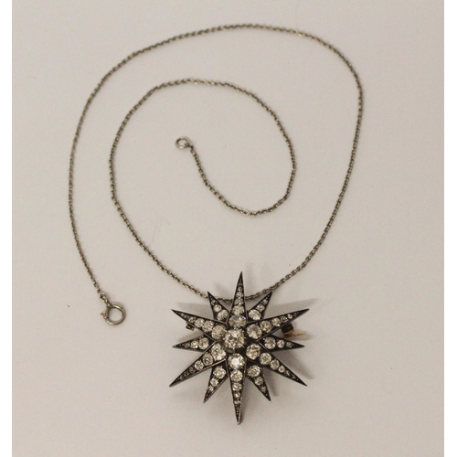 600 - A Victorian gold, silver and graduated old cut diamond set starburst pendant / brooch, with associat... 