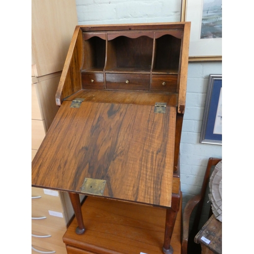 47 - A ladies small walnut bureau fitted two drawers on cabriole style legs, 20