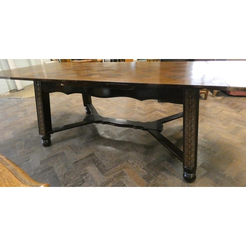 413 - A large French oak drawer leaf dining table with parquetry style top standing on a heavy cross stret... 