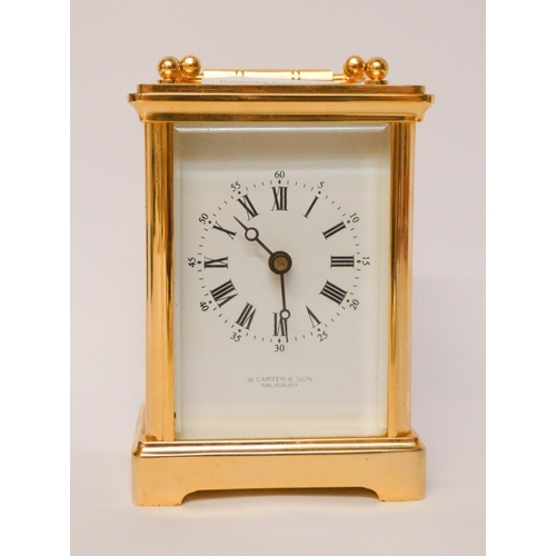 228 - A gilt brass carriage clock with white enamel dial signed W Carter & Son Salisbury