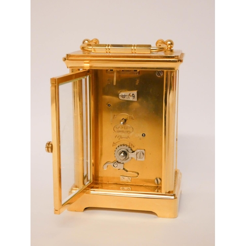 228 - A gilt brass carriage clock with white enamel dial signed W Carter & Son Salisbury