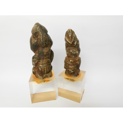 244 - A pair of unusual tribal pottery figures, later mounted on flexi-glass display bases, overall height... 