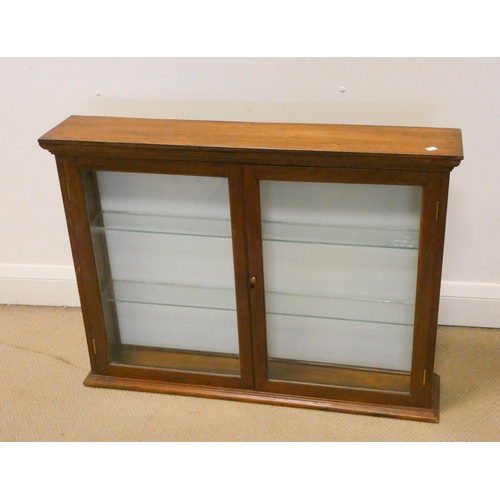 396 - A small mahogany glazed two door display cabinet, 31