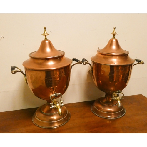 407 - A pair of Victorian copper and brass mounted Samovars, each 20