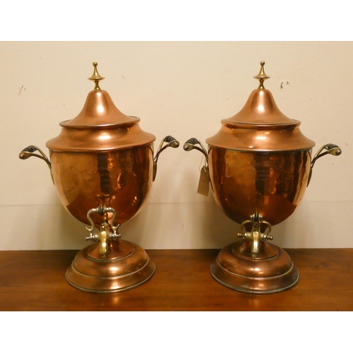 407 - A pair of Victorian copper and brass mounted Samovars, each 20