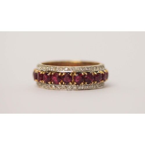 531 - Large and impressive ruby and diamond full eternity ring, set with 20 claw set circular rubies, flan... 