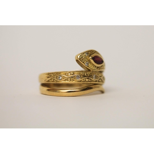 533 - 18ct yellow gold ruby and diamond snake design ring, the serpents head set with a marquis shaped rub... 