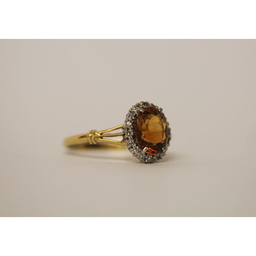 549 - Large oval citrine and diamond cluster ring set in 18ct yellow gold, shank marked 18ct, ring size V,... 