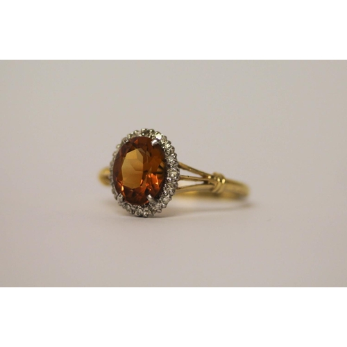 549 - Large oval citrine and diamond cluster ring set in 18ct yellow gold, shank marked 18ct, ring size V,... 