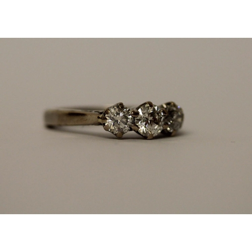 573 - A three stone diamond ring set three claw set brilliant cut diamonds, 1ct diamond weight, marked in ... 