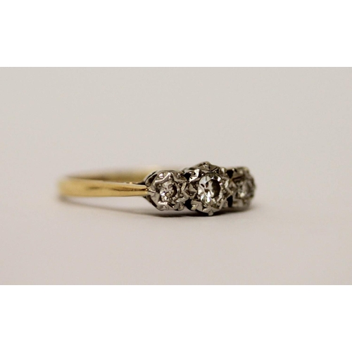 583 - A vintage three stone diamond ring, on 18ct gold and platinum band, ring size L, weight 2.5g