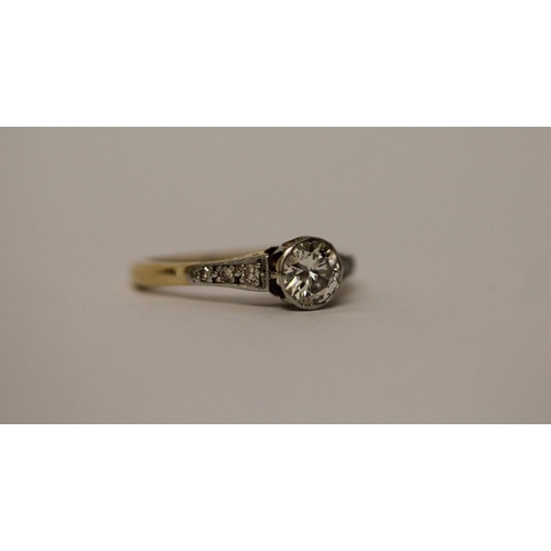 584 - A vintage diamond engagement ring, set with a circular brilliant cut diamond in rub over setting, ri... 