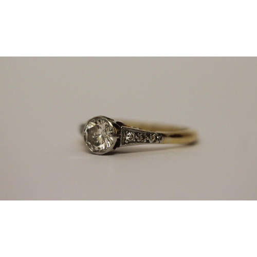 584 - A vintage diamond engagement ring, set with a circular brilliant cut diamond in rub over setting, ri... 