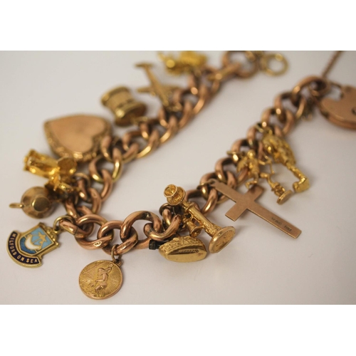 599 - A rose gold charm bracelet, the 9ct curb chain set with 12 hallmarked 9ct gold charms and a gold fro... 