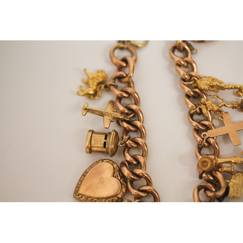 599 - A rose gold charm bracelet, the 9ct curb chain set with 12 hallmarked 9ct gold charms and a gold fro... 