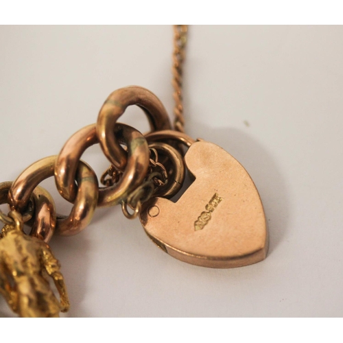 599 - A rose gold charm bracelet, the 9ct curb chain set with 12 hallmarked 9ct gold charms and a gold fro... 