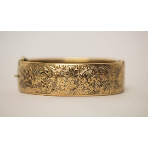 625 - A silver gilt wide hinged bangle