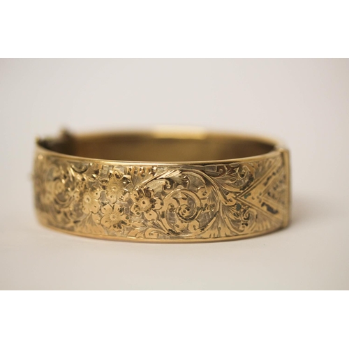 625 - A silver gilt wide hinged bangle