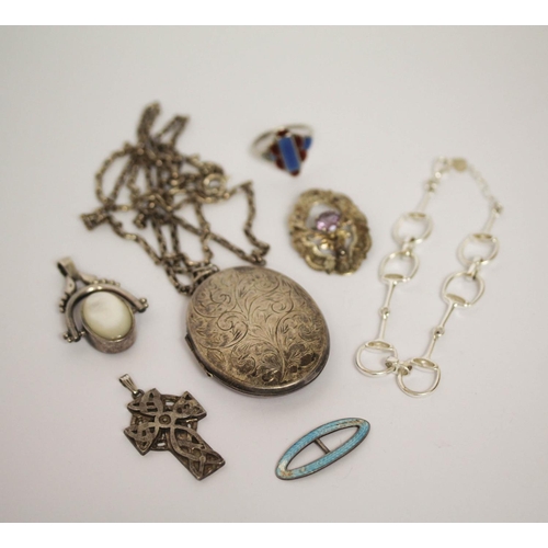 630 - A large oval silver locket on a chain, horse bit silver bracelet, rings brooch etc