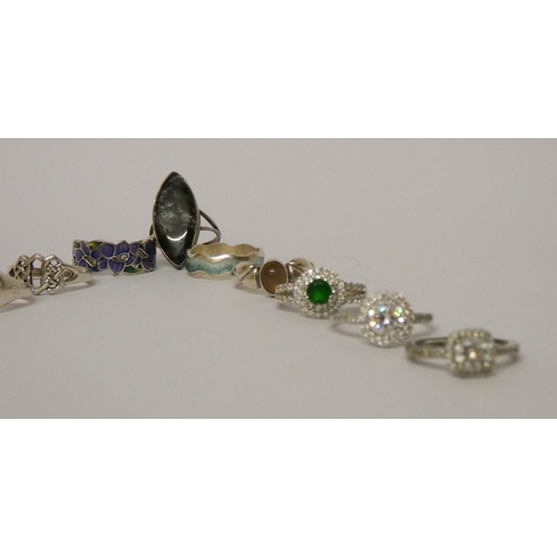 512 - A collection of ladies silver stone set dress rings