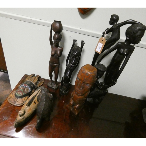 421 - Carved African tribal figurines, Elephant, large pierced wall mask and two smaller wall masks