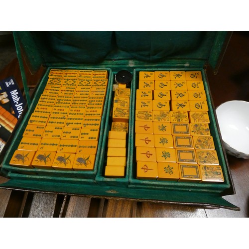 199 - A Mahjong set with boards and an assortment of cutlery